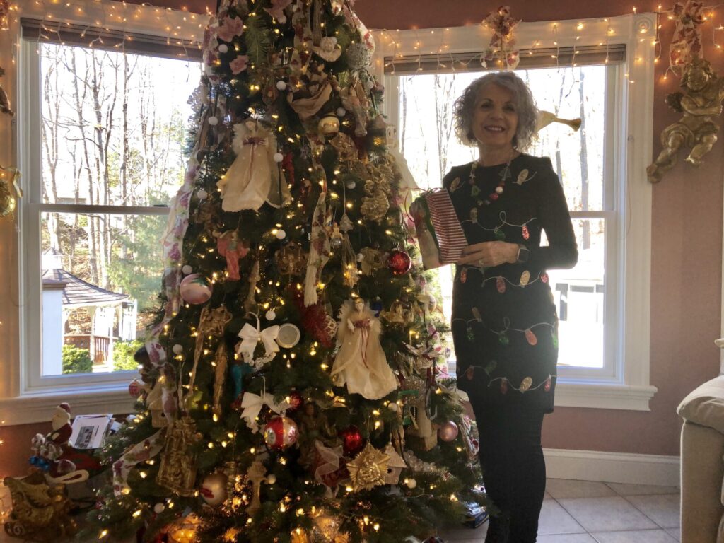 Woman next to a Christmas tree