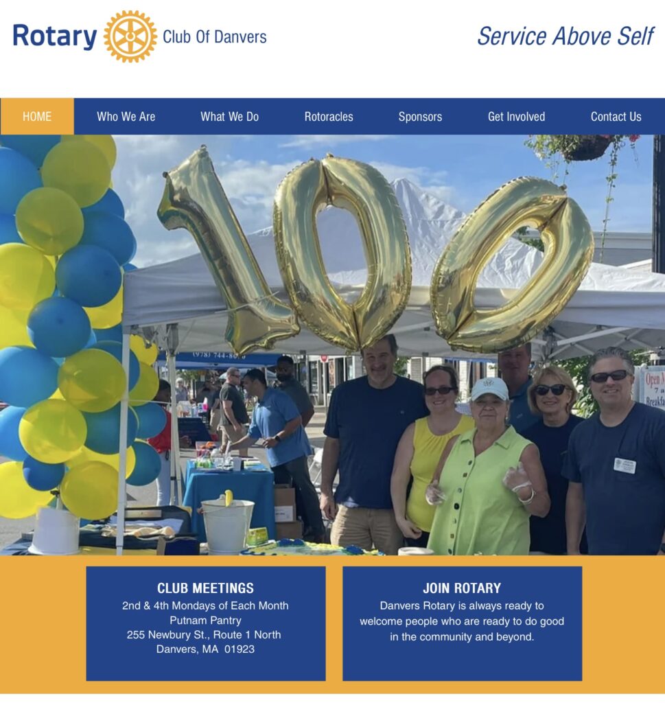 A group of men and women with balloons
