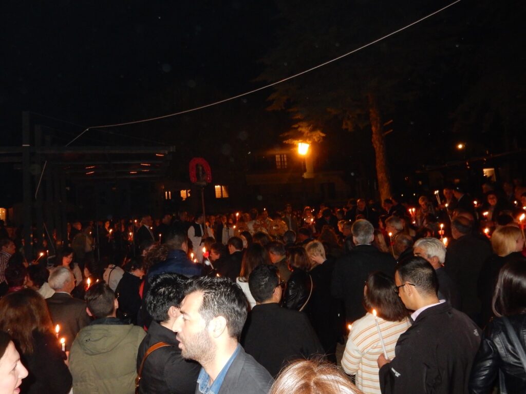 A crowd holding lit candles