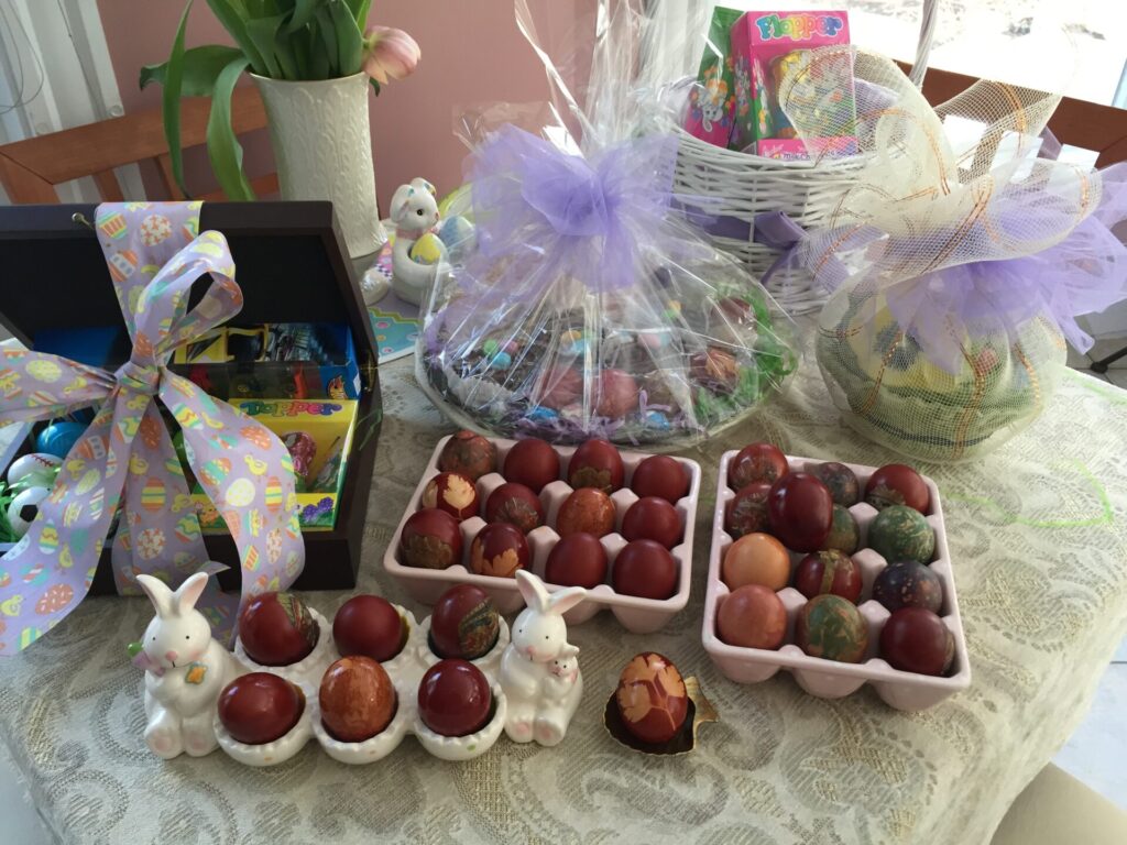 Colored eggs on platters and Easter baskets