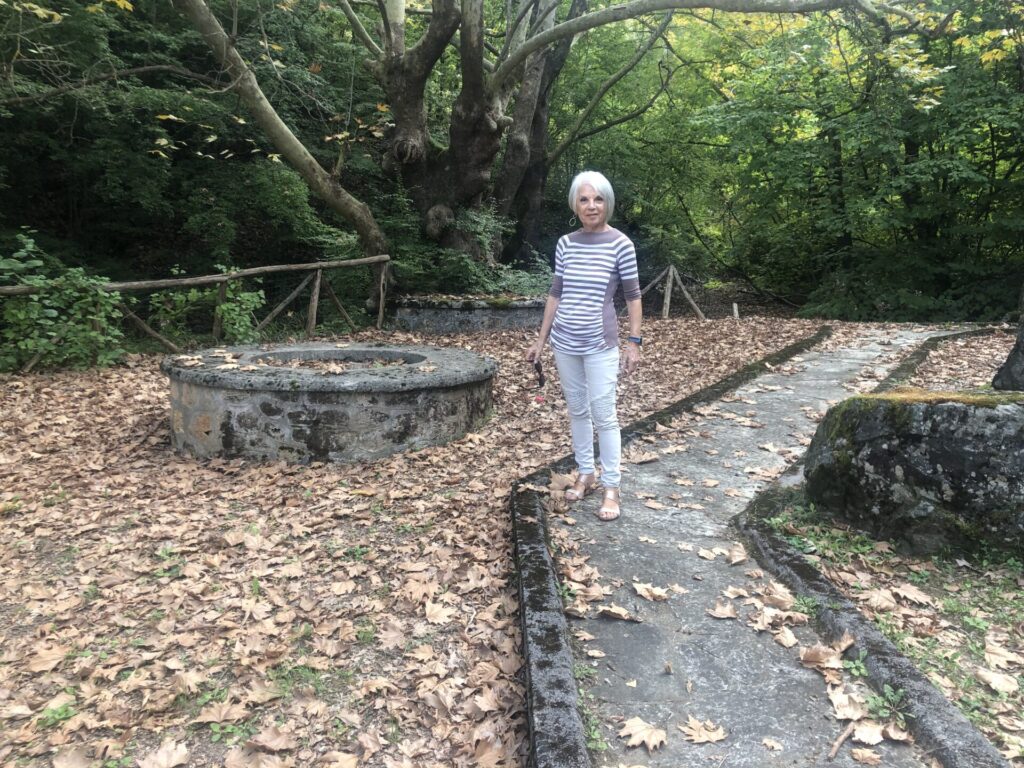 A woman standing by the woods