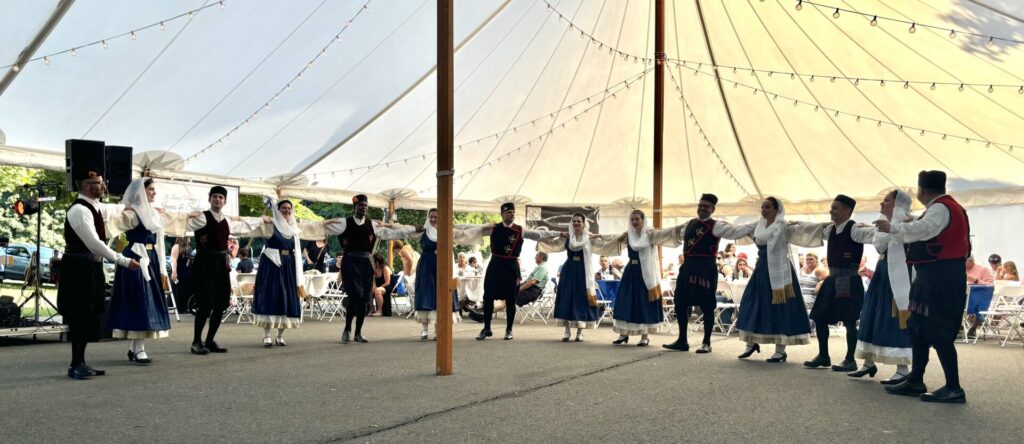 Traditional Greek men and women dancers